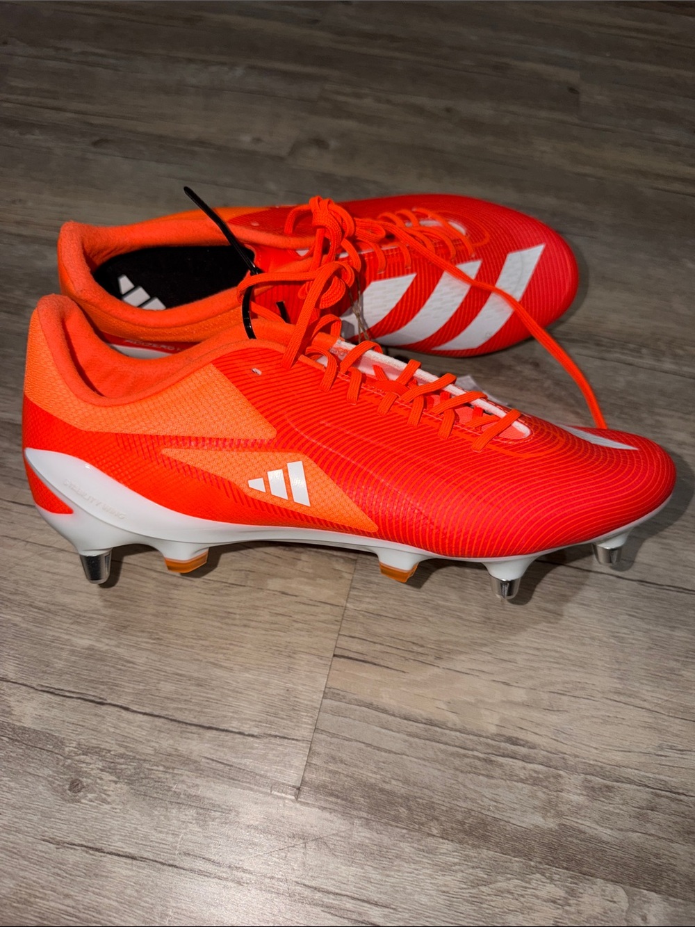 adidas Men’s Bright Orange Soccer Cleats with White Stripes